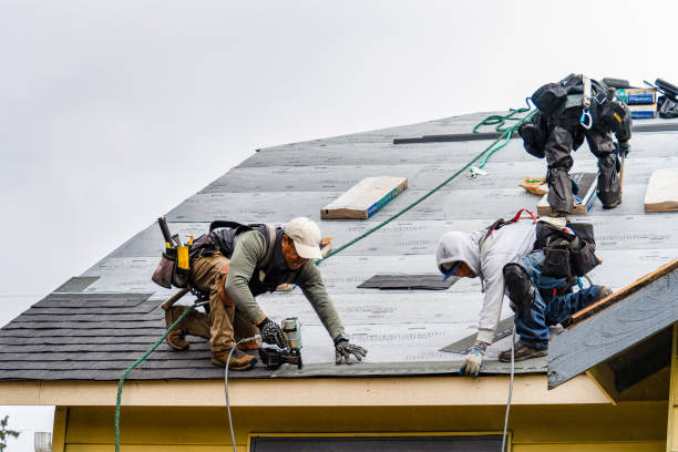 Professional Roofing technician working in Winterport, ME